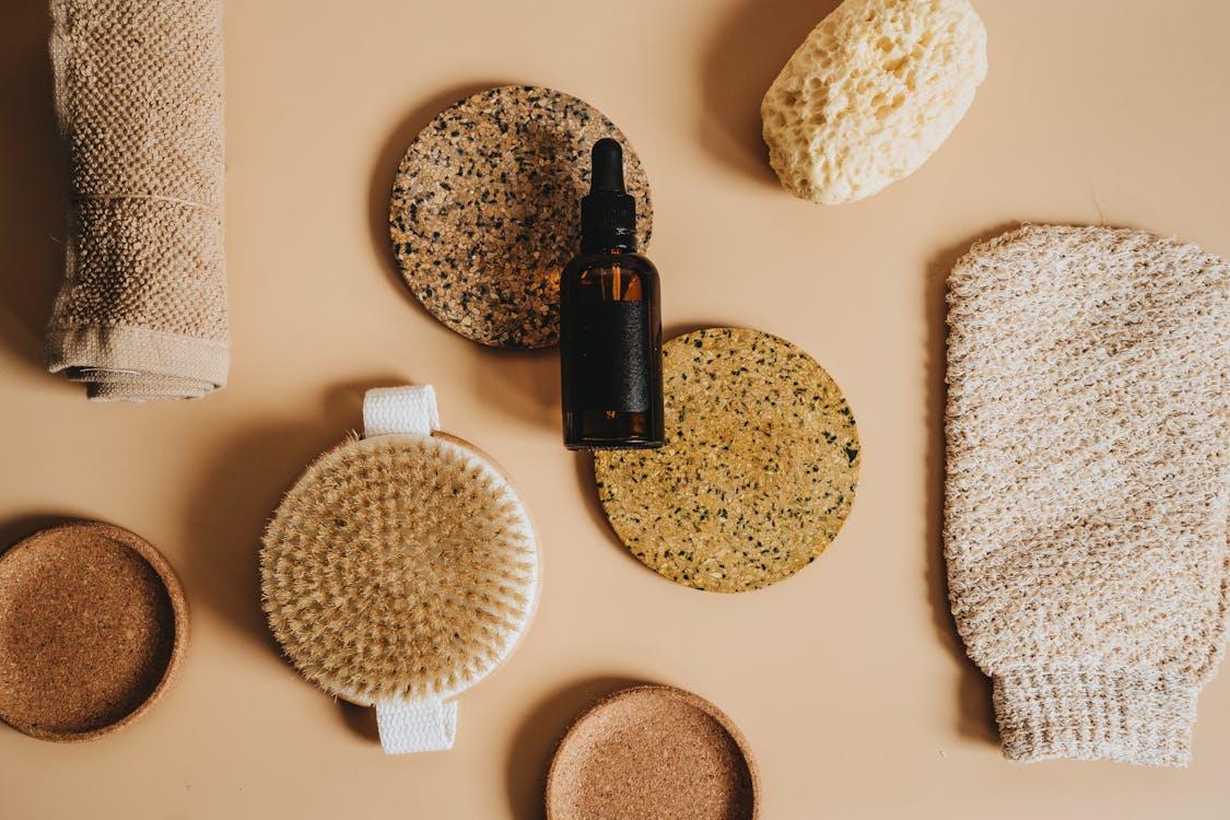 A small bottle of oil and fragrance on a table.