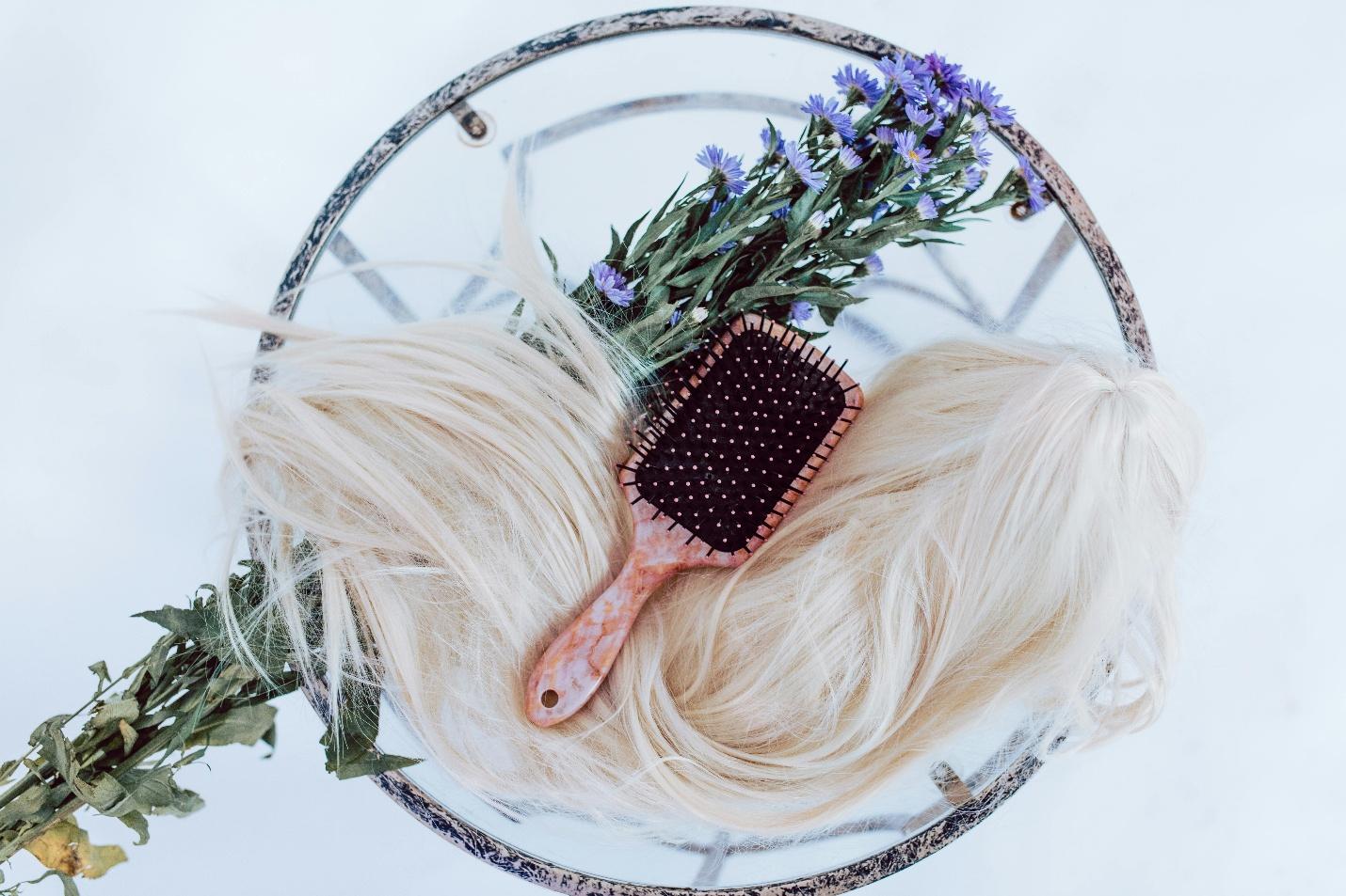A wig and a brush A wig and a brush